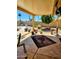 Covered back patio with stamped concrete, a ceiling fan, and a view of the landscaped backyard at 23833 N 39Th N Ln, Glendale, AZ 85310