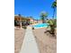 Expansive backyard featuring a swimming pool, covered patio, and low-maintenance desert landscaping at 23833 N 39Th N Ln, Glendale, AZ 85310