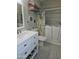This bathroom features black and white tile flooring, marble countertops, and a walk-in bathtub at 23833 N 39Th N Ln, Glendale, AZ 85310