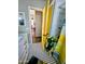 Bright bathroom featuring black and white tile flooring, a yellow door, and a marble vanity at 23833 N 39Th N Ln, Glendale, AZ 85310