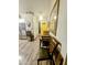 Hallway with wood floors, yellow door, and table with chairs at 23833 N 39Th N Ln, Glendale, AZ 85310
