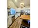 Bright updated kitchen with white cabinets, butcher block island and stainless steel appliances at 23833 N 39Th N Ln, Glendale, AZ 85310