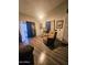 View of the living room with sliding glass doors to the patio and a recliner at 23833 N 39Th N Ln, Glendale, AZ 85310