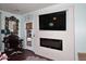 Bedroom with fireplace and television, plus a work space at 2413 S 121St Dr, Avondale, AZ 85323