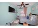 Light and airy bedroom featuring plush carpeting, soft blue walls, and a ceiling fan at 2413 S 121St Dr, Avondale, AZ 85323