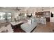 Spacious open-concept living area connecting the kitchen, dining, and lounge areas at 2413 S 121St Dr, Avondale, AZ 85323