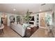 Bright living room featuring a comfortable sofa, built-in shelving, and decorative accents at 2413 S 121St Dr, Avondale, AZ 85323