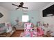 A living room with hardwood flooring, light blue walls, and well-placed decor at 2413 S 121St Dr, Avondale, AZ 85323
