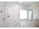 Modern shower with a large rain shower head and tiled walls at 2413 S 121St Dr, Avondale, AZ 85323