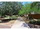 Tree-lined community walking path, perfect for exercise and enjoying the outdoors at 2413 S 121St Dr, Avondale, AZ 85323