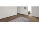 A spacious bedroom with a rug leads to a view of the bathroom at 2524 E Elmwood St, Mesa, AZ 85213