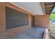 Welcoming covered entrance with brick walls and neutral-toned flooring at 2524 E Elmwood St, Mesa, AZ 85213