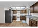 Kitchen offers stainless steel appliances, tile flooring and plenty of cabinets at 2524 E Elmwood St, Mesa, AZ 85213