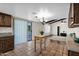 Kitchen dining nook with tile floors, wood cabinets and sliders to backyard at 2524 E Elmwood St, Mesa, AZ 85213
