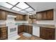 Kitchen provides stainless steel appliances, neutral countertops and wood cabinets at 2524 E Elmwood St, Mesa, AZ 85213