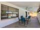 This covered patio provides a cool shaded area, great for relaxation and enjoying the pool view at 2524 E Elmwood St, Mesa, AZ 85213