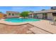 Backyard pool featuring a pool house and mature landscaping, perfect for relaxing and entertaining at 2524 E Elmwood St, Mesa, AZ 85213