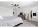 A primary bedroom featuring plush carpeting, a ceiling fan, neutral walls and a double dresser with a mirror at 26116 N Thornhill Dr, Peoria, AZ 85383