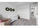 Bright Bedroom with modern crib, wreaths, and closet providing plenty of storage at 26116 N Thornhill Dr, Peoria, AZ 85383