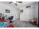 Comfortable bedroom with ceiling fan, closet, desk and charming decor for a cozy retreat at 26116 N Thornhill Dr, Peoria, AZ 85383