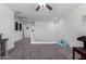 An upstairs landing area with neutral walls, plush carpeting, a ceiling fan and a light blue beanbag chair at 26116 N Thornhill Dr, Peoria, AZ 85383
