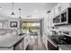 Bright kitchen with stainless steel appliances, granite countertops, and an eat-in dining area at 26116 N Thornhill Dr, Peoria, AZ 85383