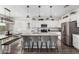 Stylish kitchen with an island, stainless steel appliances, and a dining area nearby at 26116 N Thornhill Dr, Peoria, AZ 85383