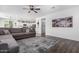 Spacious living room with modern flooring and comfortable seating, perfect for relaxation at 26116 N Thornhill Dr, Peoria, AZ 85383