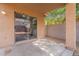 A covered back patio with a sliding glass door enhances indoor-outdoor living at 2745 W Sunshine Butte Dr, San Tan Valley, AZ 85144