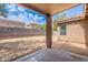 View of a spacious backyard with block fence and covered patio at 2745 W Sunshine Butte Dr, San Tan Valley, AZ 85144