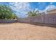 A large, empty backyard is framed by a block wall fence at 2745 W Sunshine Butte Dr, San Tan Valley, AZ 85144