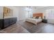 Relaxing bedroom featuring neutral walls, a plush bed, and ample natural light from multiple windows at 2745 W Sunshine Butte Dr, San Tan Valley, AZ 85144