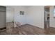 Bedroom includes a mirrored closet, vinyl floors, and a funky chair at 2745 W Sunshine Butte Dr, San Tan Valley, AZ 85144