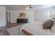 Spacious bedroom with wood-look floors, large bed, and serene ambiance at 2745 W Sunshine Butte Dr, San Tan Valley, AZ 85144