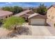 Inviting single-story home with a two-car garage and desert landscaping at 2745 W Sunshine Butte Dr, San Tan Valley, AZ 85144
