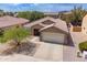 Charming single-story home with a well-maintained front yard and two-car garage at 2745 W Sunshine Butte Dr, San Tan Valley, AZ 85144