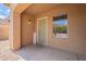 Inviting front porch with a green door, welcome sign, and window with a view at 2745 W Sunshine Butte Dr, San Tan Valley, AZ 85144