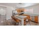 Kitchen with stainless steel appliances, an island with seating, and modern lighting at 2745 W Sunshine Butte Dr, San Tan Valley, AZ 85144