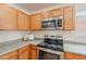 Kitchen with a stainless steel oven and microwave at 2745 W Sunshine Butte Dr, San Tan Valley, AZ 85144