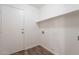 Convenient laundry room featuring vinyl floors and a shelf for storage at 2745 W Sunshine Butte Dr, San Tan Valley, AZ 85144
