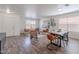Open living and dining area with hardwood floors and lots of natural light at 2745 W Sunshine Butte Dr, San Tan Valley, AZ 85144