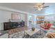 An open-concept living room and kitchen offers modern finishes with lots of space for entertaining at 2745 W Sunshine Butte Dr, San Tan Valley, AZ 85144