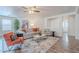 The living room offers a comfortable seating arrangement and is bathed in natural light at 2745 W Sunshine Butte Dr, San Tan Valley, AZ 85144