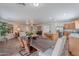 Open-concept living space with dining area, kitchen, and living room is perfect for entertaining at 2745 W Sunshine Butte Dr, San Tan Valley, AZ 85144