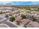 Aerial view of a well-maintained neighborhood with a mix of homes and mature trees at 2745 W Sunshine Butte Dr, San Tan Valley, AZ 85144