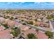 Wide aerial shot of a residential area with a mix of single-Gathering homes and community landscaping at 2745 W Sunshine Butte Dr, San Tan Valley, AZ 85144