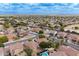Expansive aerial view showcases a vast residential community with mountain views at 2745 W Sunshine Butte Dr, San Tan Valley, AZ 85144