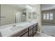 Bathroom featuring a double sink vanity with a large framed mirror for natural light at 2821 S Skyline Dr # 149, Mesa, AZ 85212