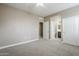 Bedroom with ceiling fan and direct access to the ensuite bathroom and walk-in closet at 2821 S Skyline Dr # 149, Mesa, AZ 85212