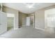 Spacious bedroom with carpet and white trim, offering access to the closet and ensuite bathroom at 2821 S Skyline Dr # 149, Mesa, AZ 85212